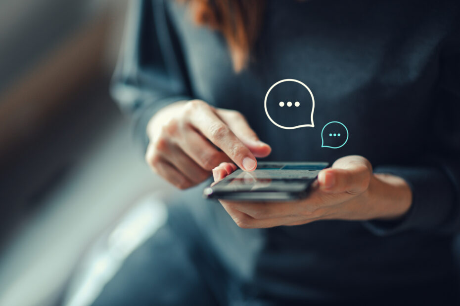 Womens hand typing on mobile smartphone Live Chat Chatting on application Communication Digital Web and social network Concept - JoberTalk digital marketing content for tiktok, youtube, instagram and facebook